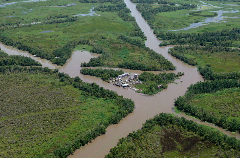 An oil facility is seen in the middle of canals dug for oil pipelines on the coast of Louisiana, Wednesday, July 28, 2010. AP images